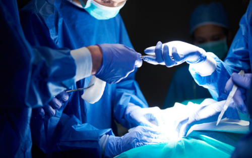 Medical team performing surgery in a Chh Sambhajinagar women's healthcare facility.